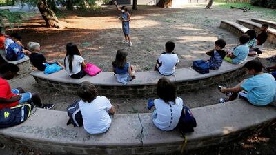 Children attend an open-air lesson as they return to the Simonetta Salacone primary and secondary school in Rome, Italy. Reuters