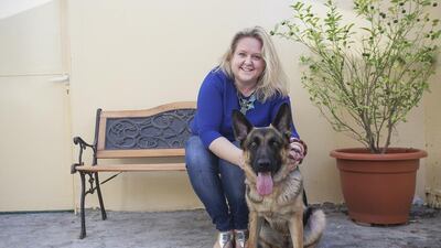 Sarah Barlett and Bonnie, a two-year-old homeless German Shepherd. Mona Al Marzooqi / The National