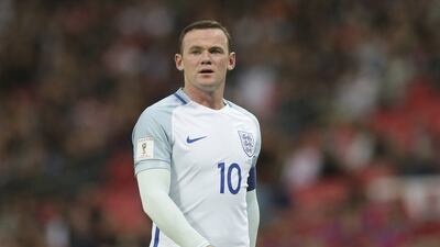 England's Wayne Rooney has been dropped to the bench for the World Cup qualifier against Slovenia. Tim Ireland / AP Photo
