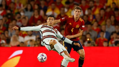 Portugal's Cristiano Ronaldo in action with Spain's Pau Torres during the 1-1 Uefa Nations League draw in Seville. Reuters