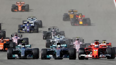 Mercedes driver Lewis Hamilton and Ferrari driver Sebastian Vettel lead the pack. Eric Gay / AP Photo