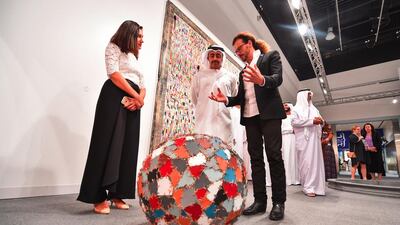 Sheikh Abdullah bin Zayed and Sheikh Nahyan bin Mubarak, Minister of Culture and Knowledge Development, look over some of the art on display at Abu Dhabi Art. Wam