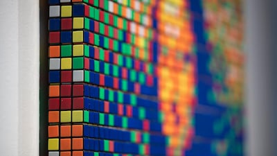 A work of art entitled 'Rubik Mona Lisa' (2005) by street artist Invader is displayed at Artcurial auction house in Paris, France. EPA