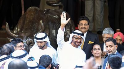 Sheikh Mohammed bin Zayed, Crown Prince of Abu Dhabi and Deputy Supreme Commander of the UAE Armed Forces, waves in front of a bull statue at the Bombay Stock Exchange (BSE) building, in Mumbai, India on February 12, 2016. Divyakant Solanki/EPA
