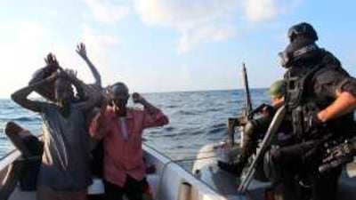 A group of suspected pirates are questioned by Nato troops about 170km off the Somali coast recently.