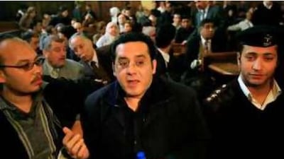 Ayman Nour, centre, arrives last March under police escort at Egypt's high court, where his appeal to be released from prison was turned down.