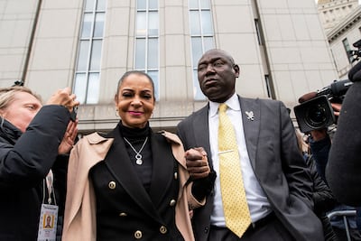 Ben Crump, a civil rights lawyer representing the Townsend family, holds hands with Kathryn Townsend Griffin, daughter of Ed Townsend. Reuters
