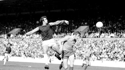 Geoff Hurst (left) has called for a ban on children heading the football. Getty Images
