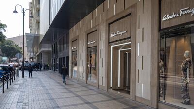 Pedestrians walk past a Salvatore Ferragamo SpA store on Canton Road in the Tsim Sha Tsui district of Hong Kong, China, on Wednesday, Feb. 19, 2020. Hong Kong is heading for its first back-to-back annual recessions on record, as the coronavirus shutdown cripples an economy already battered by months of political unrest. Photographer: Justin Chin/Bloomberg