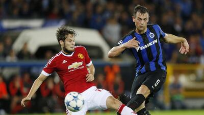 Manchester United's Daley Blind attempts to tackle Club Brugge's Tom De Sutter during their match on Wednesday night in the Champions League. Carl Recine / Action Images / Reuters