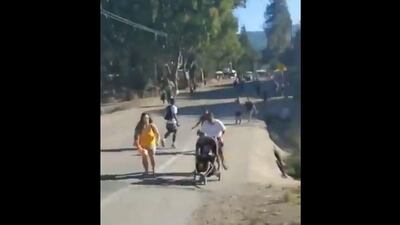 This screen grab taken from a handout video footage shows people running away from gunshots. AFP