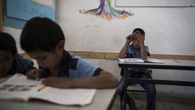 Pupils take part in a classroom activity.