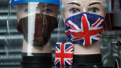 A Union Jack design face mask is seen for sale in the window of a shop in Manchester, Britain. Reuters