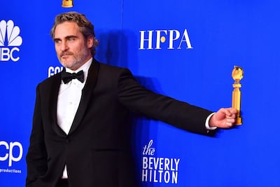 US actor Joaquin Phoenix poses in the press room after winning the award for Best Performance by an Actor in a Motion Picture - Drama. AFP
