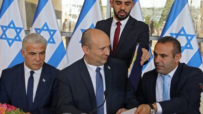 Israeli Foreign Minister Yair Lapid, Prime Minister Nafrali Bennet and politician and Knesset member Abir Kara attend a weekly cabinet meeting in Jerusalem. Reuters