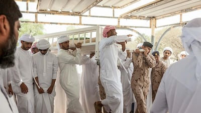 Mourners carry the body of Hayayei in July 2017, after his death in an accident in London. Antonie Robertson / The National