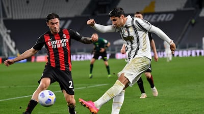 Juve's Alvaro Morata gets a cross cross under pressure from Davide Calabria of Milan. Getty