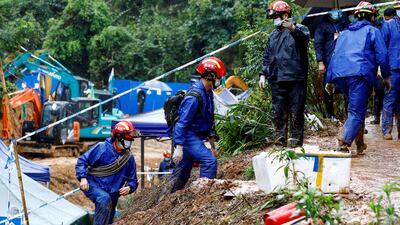 Rescue workers at the site where a China Eastern Airlines Boeing 737-800 crashed in March. Reuters