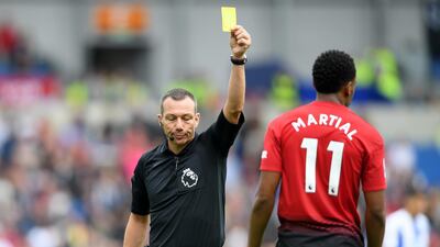 Anthony Martial of Manchester United is shown a yellow card. Getty