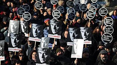 Supporters of Hrant Dink march outside the courthouse in Istanbul where the trial of two accomplices to the 2007 killing of the Turkish-Armenian journalist was heard yesterday.