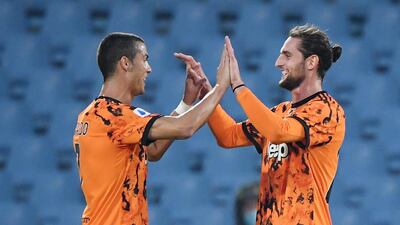Juventus' Cristiano Ronaldo celebrates with Adrien Rabiot after the match against Spezia. Reuters