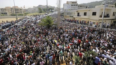 Thousands of Syrain nationals living in Lebanon arrive outside the Syrian Embassy in Yarze east of Beirut on Wednesday before voting in the upcoming presidential elections in Syria. Filling the streets around the embassy in Beirut, thousands of Syrians turned out to vote in a controversial presidential election that Bashar Al Assad is expected to clinch effortlessly, as civil war rages. Joseph Eid / AFP
