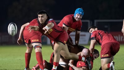Bahrain scrum-half Caprice Cocker of passes the ball.