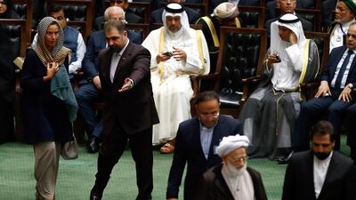 EU foreign policy chief Federica Mogherini, left, arrives to attend the Iranian parliament. EPA