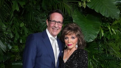 Percy Gibson and Joan Collins