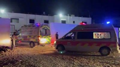 Ambulances pass through an entrance at Al Shifa Hospital in Gaza city during the evacuation of people from Kamal Adwan Hospital in northern Gaza. Reuters