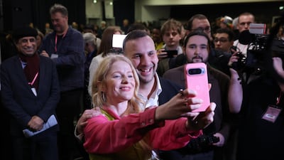 Ms Spencer and Mr Polanski take a selfie. EPA