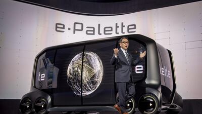 Akio Toyoda, president of Toyota Motor Corp., stands in front of the e-Palette concept vehicle at CES in Las Vegas. David Paul Morris / Bloomberg