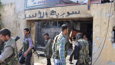 Free Syrian Army opposition fighters storm the Shaar district police station. Pierre Thomas / AFP Photo