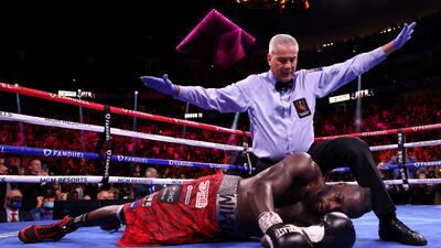 Referee Russell Mora stops the fight after Tyson Fury knocks out Deontay Wilder in the 11th round during their WBC heavyweight title fight at T-Mobile Arena in Las Vegas on October 9. AFP