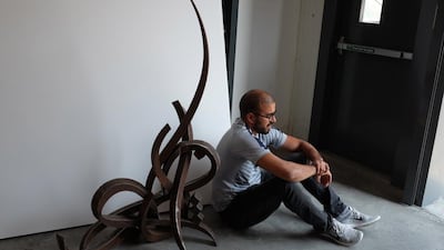 Looking pensive. eL Seed in his new permanent studio in Alserkal Avenue in Dubai. Photos by Sueraya Shaheen
