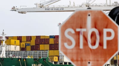 A cargo ship with shipping containers at the port of Oakland. Reuters