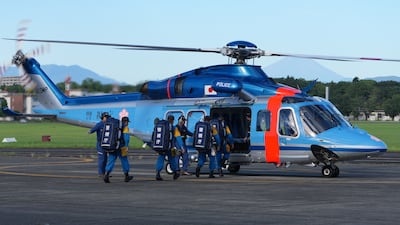 A Tokyo Police rescue team prepare to join the search for survivors in Tachikawa City. EPA