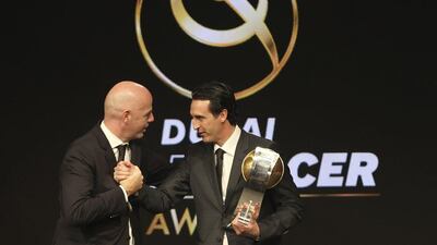 Paris Saint-Germain manager Unai Emery, right, alongside Fifa president Gianni Infantino at the Globe Soccer Awards in Dubai on Tuesday. Kamran Jebreili / AP Photo