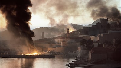 Smoke and flames rise from the walled city of Dubrovnik on November 12, 1991. The city was heavily bombarded by the Serbian-dominated Yugoslavian Federal Army after Croatia declared independence. AFP