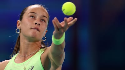 Zeynep Sonmez tosses the ball for a serve.