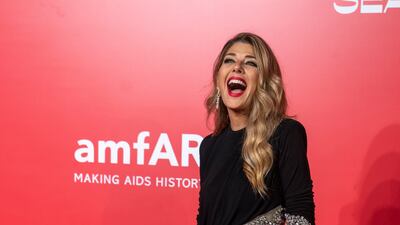 Marisa Tomei, in a black embellished dress, arrives at the amfAR dinner. AP Photo