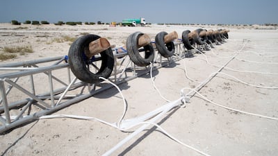 The obstacles involve tossing heavy objects, crawling under fences, climbing over walls and more