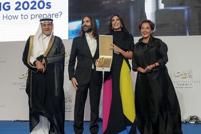 Nadine Labaki and Khaled Mouzannar receive an award of recognition from the Beirut Institute. Beirut Institute
