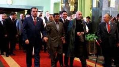 Mahmoud Ahmadinejad, the Iranian president, middle, arrives in Tehran yesterday with his counterparts from Tajikistan, Emomali Rakhmon, left; Afghanistan, Hamid Karzai, second from right; and Iraq, Jalal Talabani, right.