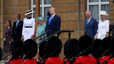 (L-R) US First Lady Melania Trump, Britain's Queen Elizabeth II, US President Donald Trump, Britain's Prince Charles, Prince of Wales and Britain's Camilla, Duchess of Cornwall watch guardsmen parade during a welcome ceremony at Buckingham Palace in central London. AFP