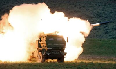 FILE - A launch truck fires the High Mobility Artillery Rocket System (HIMARS) produced by Lockheed Martin during combat training in the high desert of the Yakima Training Center, Washington on May 23, 2011. Ukraine has received about a dozen American-built HIMARS multiple rocket launchers and has used them to strike Russian ammunition depots, which are essential for maintaining Moscow's edge in firepower. (Tony Overman / The Olympian via AP, File)