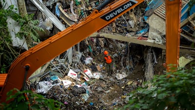 Several structures at the site, including installations operated by the landfill operator, were damaged during the collapse. Getty Images