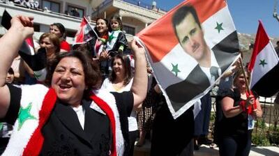 Druze in the the the village of Majdal Shams in the Golan Heights with Syrian flags and a picture of Bashar al-Assad during a rally in April. Jack Guez / AFP