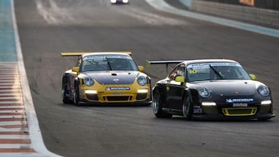 After passing him on Lap 10, Clemens Schmid, right, tried to make his Porsche as wide as possible to keep Prince Abdulaziz Al Faisal behind him.