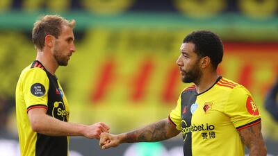 Watford's Craig Dawson shakes hands with Troy Deeney after the match. Getty